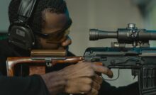a focused man aiming for the target