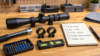Rifle scope setup checklist with scope rings, torque tool, level, and notebook for avoiding mounting mistakes